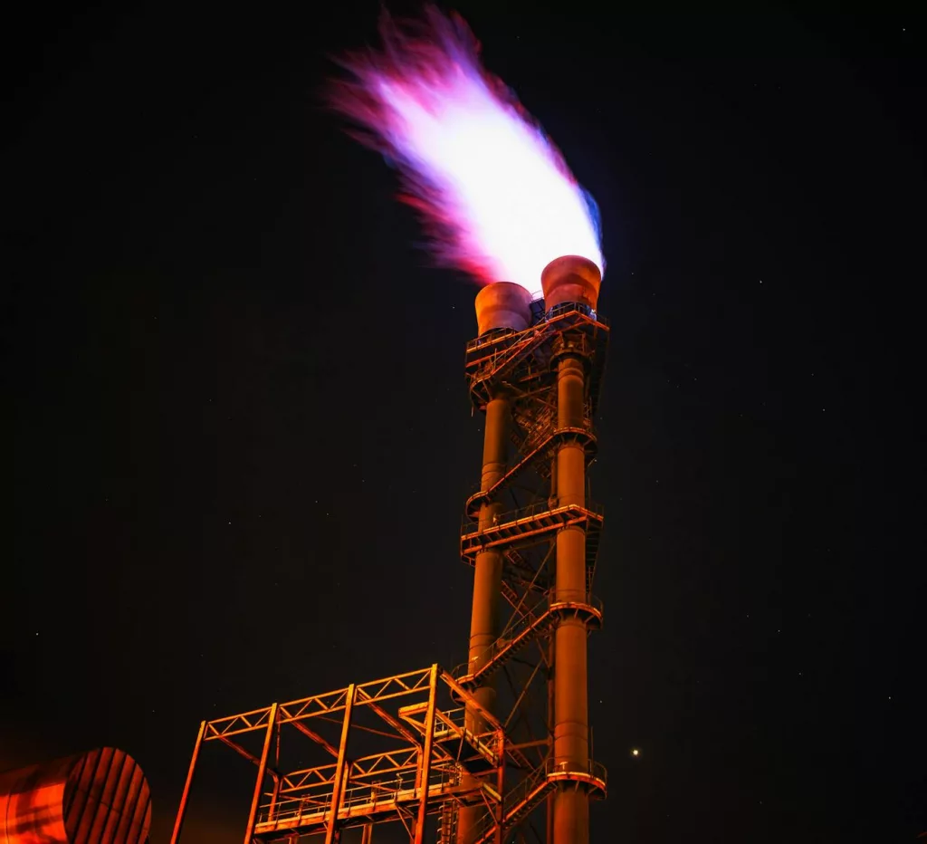 Low Angle View of gas burn off Sky at Night