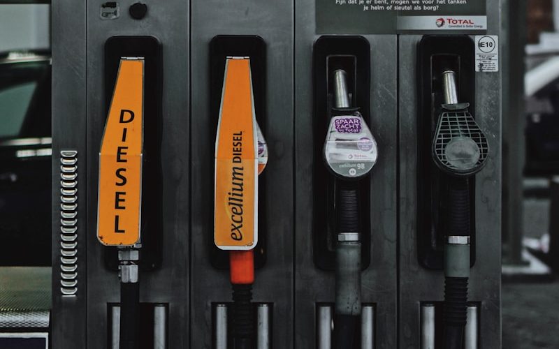 a row of fuel pumps sitting next to each other